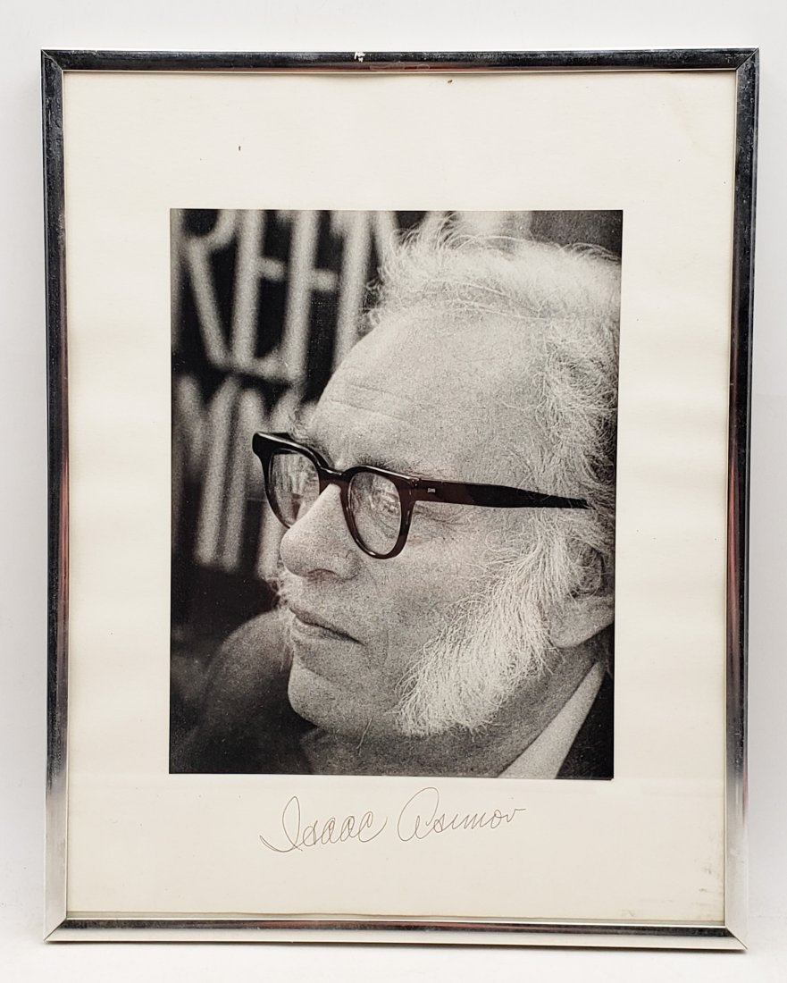 Isaac Asimov: Framed Signed Photo Portrait: B/W photo of Isaac Asimov by P.Rankin- Smith mounted on art paper /board and signed on the margin by Isaac Asimov. The signature is authentic with provenance. Image size : 7.25 x 9.25inches. Framed si