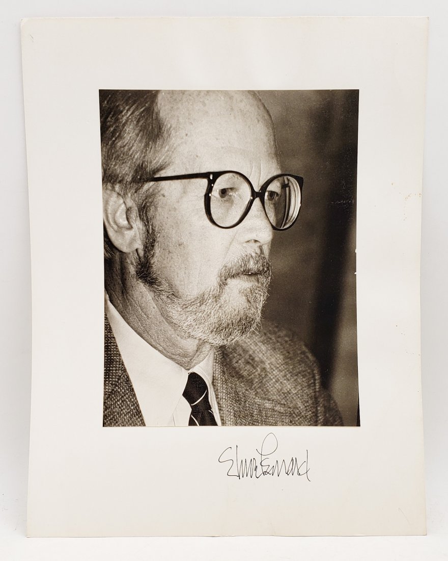 Elmore Leonard: Signed Photo Portrait: B/W photo of Elmore Leonard by P.Rankin- Smith mounted on art paper /board and signed on the margin by Elmore Leonard. The signature is authentic with provenance. Image size : 7 x 9.25 inches. Mount s