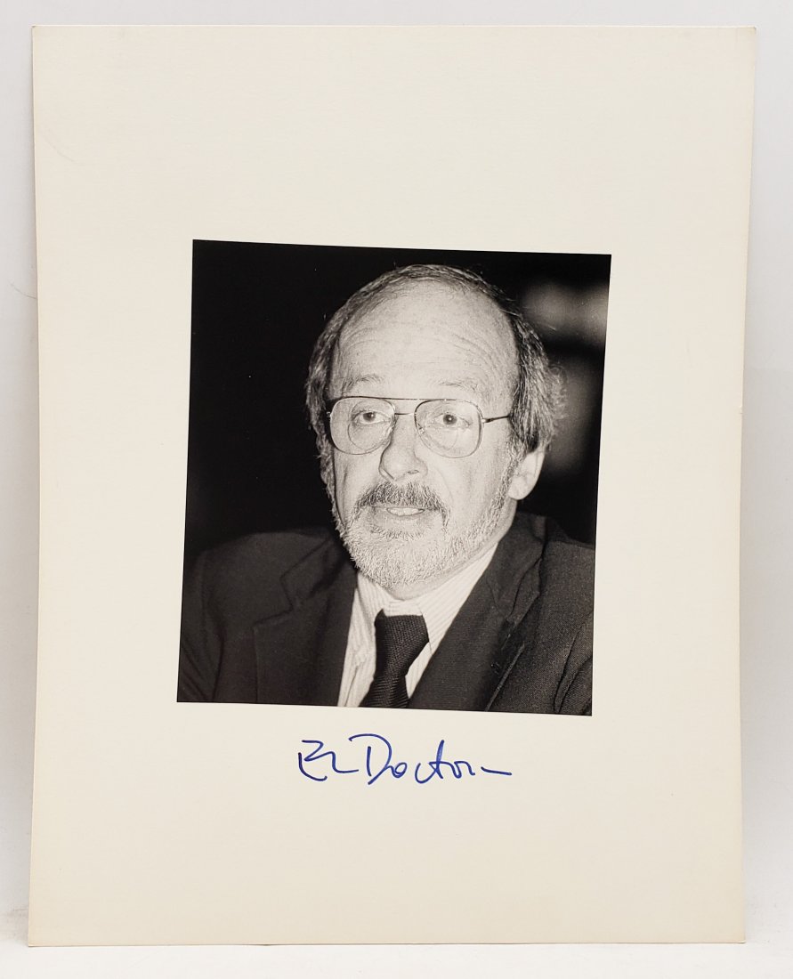E. L. Doctorow: Signed Photo Portrait: B/W photo of E. L. Doctorow by P.Rankin- Smith mounted on art paper /board and signed on the margin by E. L. Doctorow. The signature is authentic with provenance. Image size : 7.25 x 6.5 inches. Mount
