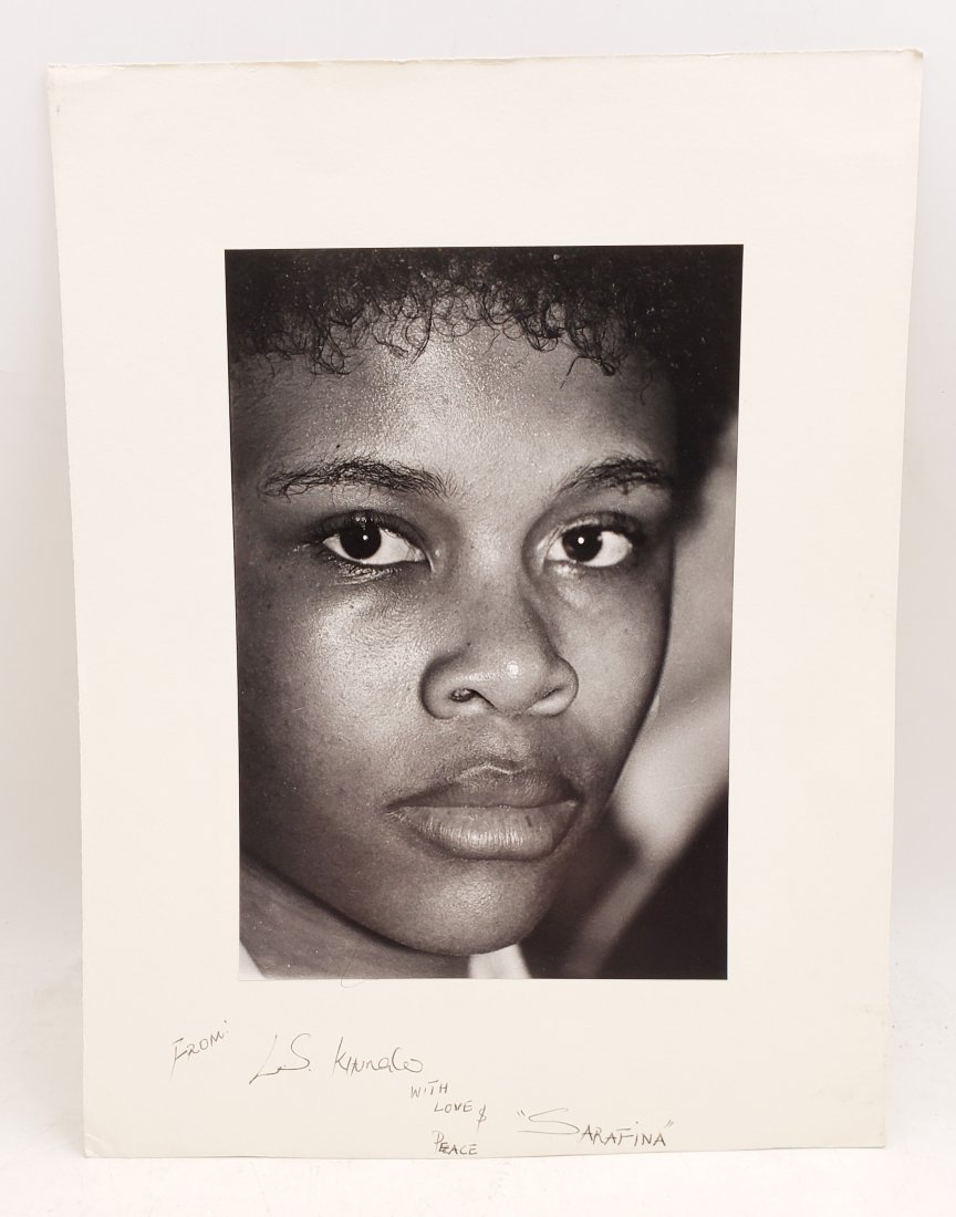 Leleti Khumalo : Signed Photo Portrait: B/W photo of Leleti Khumalo by P.Rankin- Smith mounted on art paper /board and signed on the margin by L.S Khumalo with Love and Peace, Sarafina. The signature is authentic with provenance. Image size