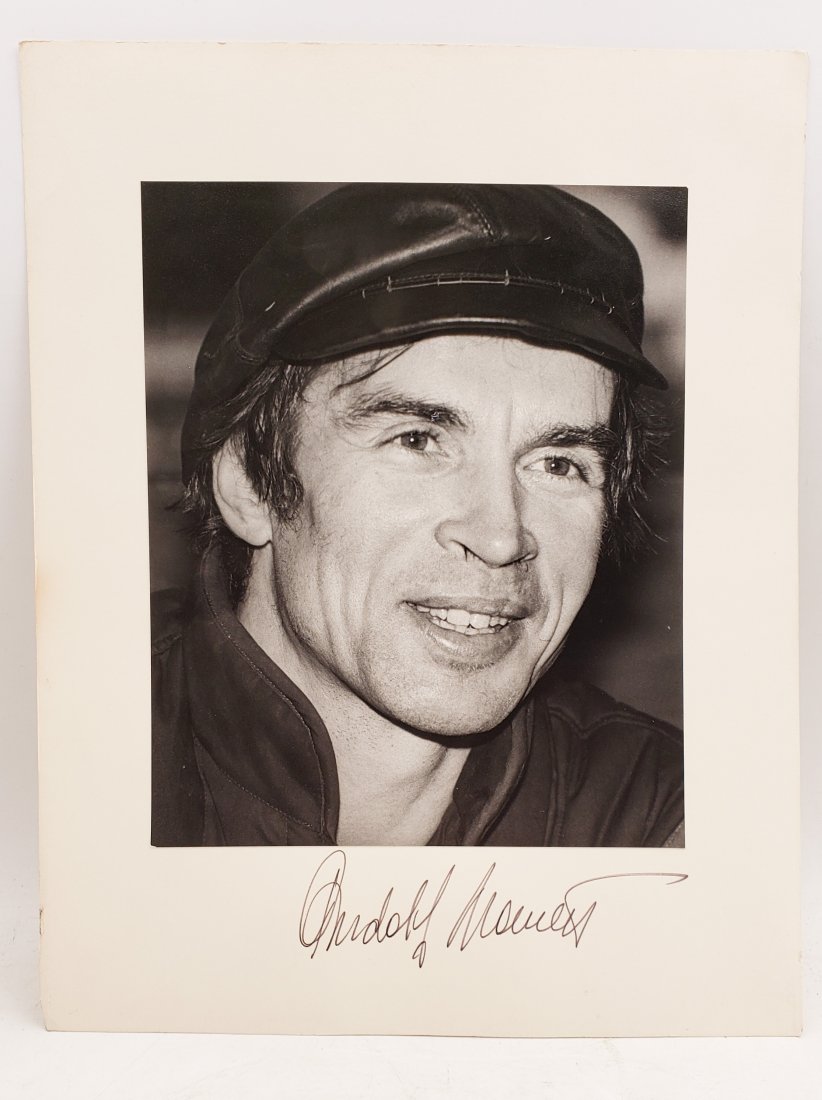 Rudolf Nureyev, 1985 : Signed Photo Portrait: B/W photo of Rudolf Nureyev by P.Rankin- Smith mounted on art paper /board and signed on the margin by Rudolf Nureyev. The signature is authentic with provenance. Image size : 7.75 x 9.5 inches. Mount