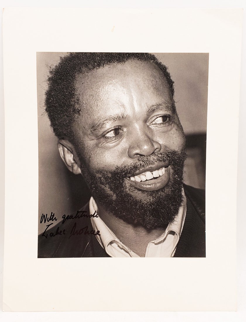 Zakes Mokae : Signed Photo Portrait: B/W photo of Zakes Mokae by P.Rankin- Smith mounted on art paper /board and signed on the margin by Zakes Mokae on the photo. The signature is authentic with provenance. Image size : 8 x 9.75 inches. 