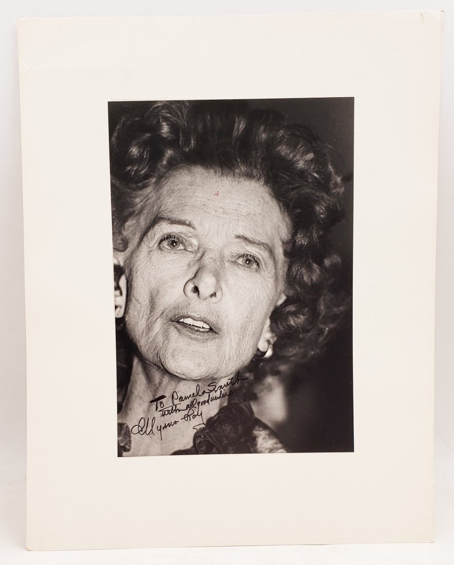 Myrna Loy: Signed Photo Portrait: B/W photo of Myrna Loy by P.Rankin- Smith mounted on art paper /board and signed on the margin by Myrna Loy. The signature is authentic with provenance. Image size : 9.5 x 6.5 inches. Mount size: 11 x