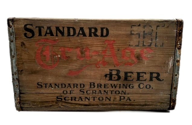 Standard Tru-Age Wood Beer Crate: Standard Tru-Age Wood Beer CrateVintage condition well made Standard Tru-Age beer crate made of wood with tin reinforced edges and red and black ink stamped sides.Size: L- 18.5 inches W- 12 inches H- 