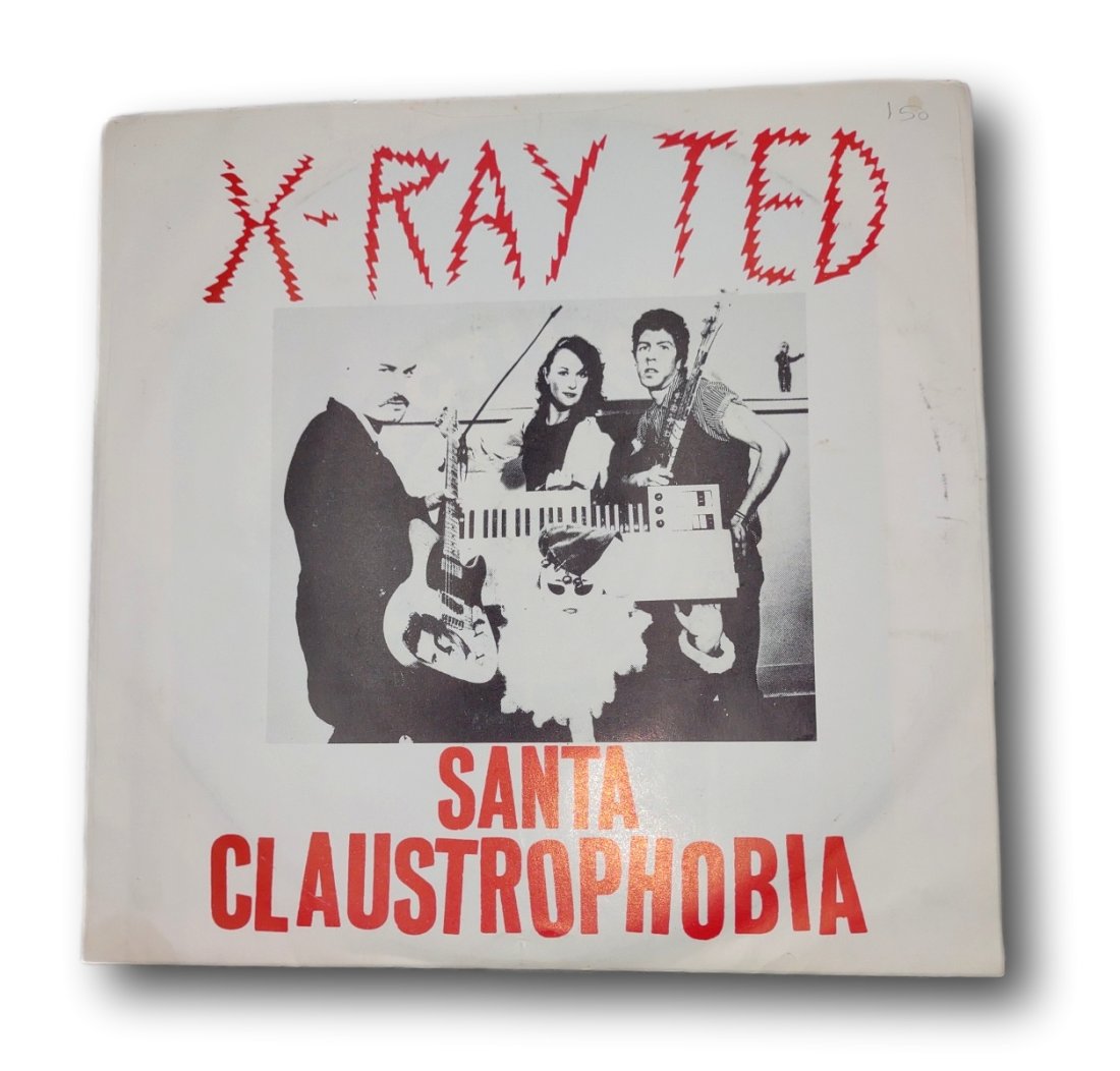 45 RPM: X-Ray Ted: Santa Claustrophobia / The Big Parade: XT9781: Band Profile: X-Ray Ted , Berkley, California, USA , Victor Moan (bass/voc) ;Ian Visible (drms);Misha Moan (gtr/voc);Cheri Webster (keyb/voc).X-Ray Ted â€“ Santa Claustrophobia / The Big Parade L
