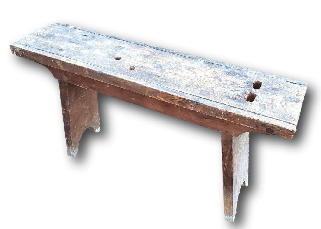 Primitive Wood Workbench: Primitive country wood workbench. Sturdy. The bench measures 4 feet long, 25 1/4 inches tall, and has a depth of 11 3/4 inches. The holes on the seat were for use to brace or hold to