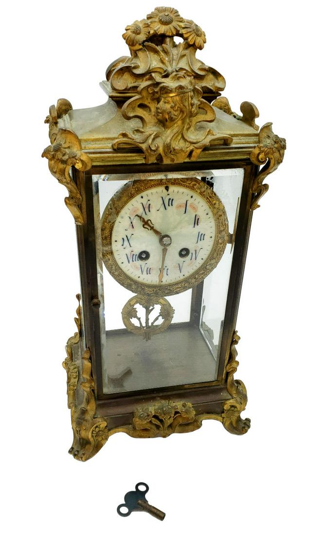 Gilt Brass Glass Encased Mantel Clock French: Movement is stamped with Japy Freres & Cie Medaille d'Honneur seal, further stamped Made in France. Beveled edge glass on all sides with front and rear-hinged doors. The front glass has a slight i
