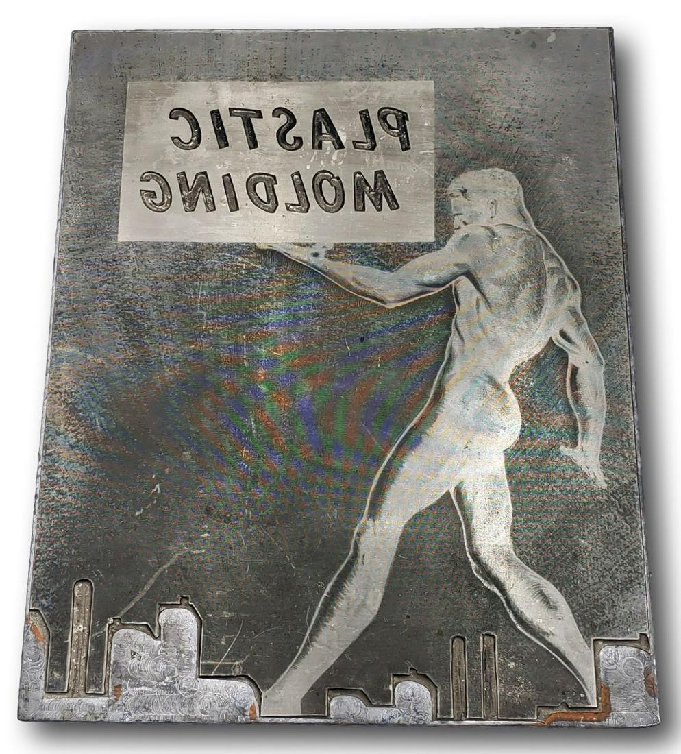 Deco Industrial Copper Advertising Wall Art: This copper printing plate is estimated to be from the 1920s / 1930s. It is heavy, layered, and features a male figure standing above a city skyline holding a sign "PLASTIC MOLDING". The piece measure