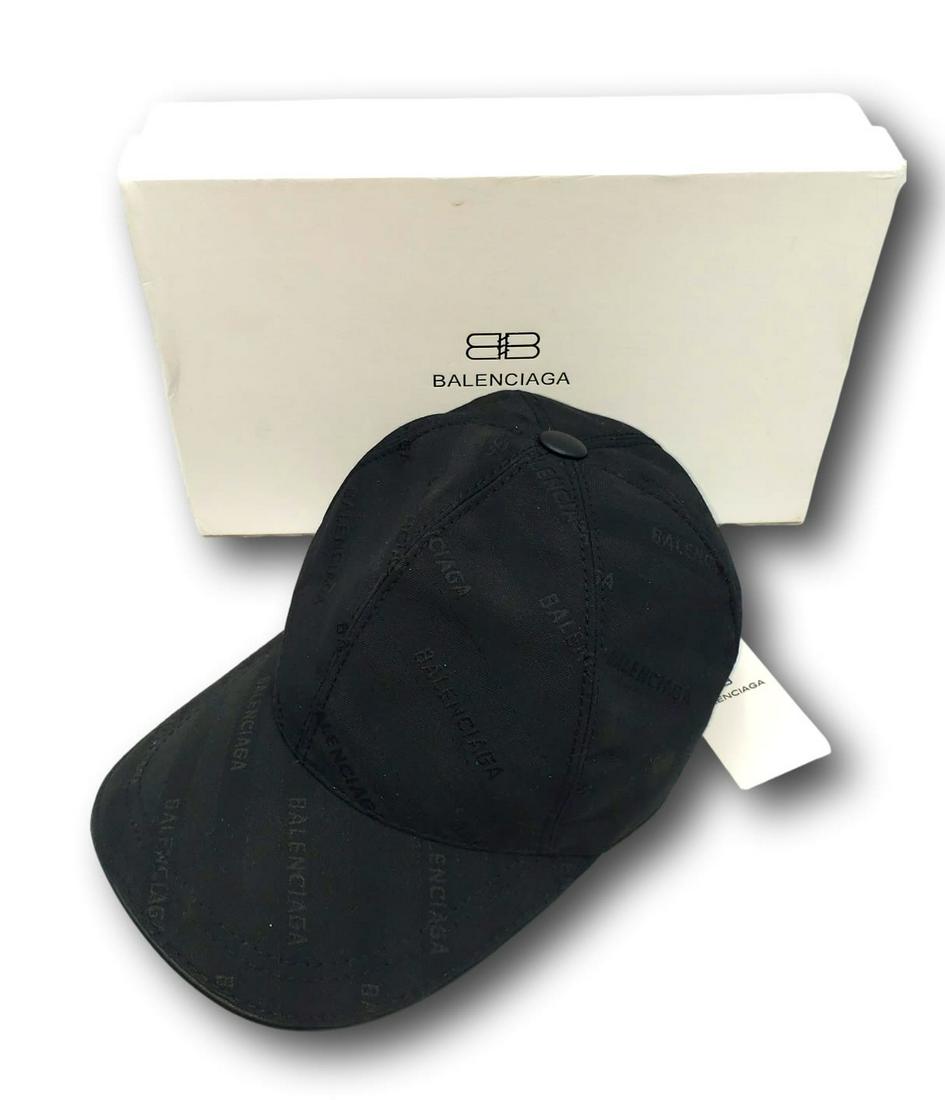Balenciaga Cap New with tags and box: Embossed full logo black on black cotton with leather strap closure.. Made in Italy, Size Medium. Please refer to the images for the best determination of the condition. We review every item to determ