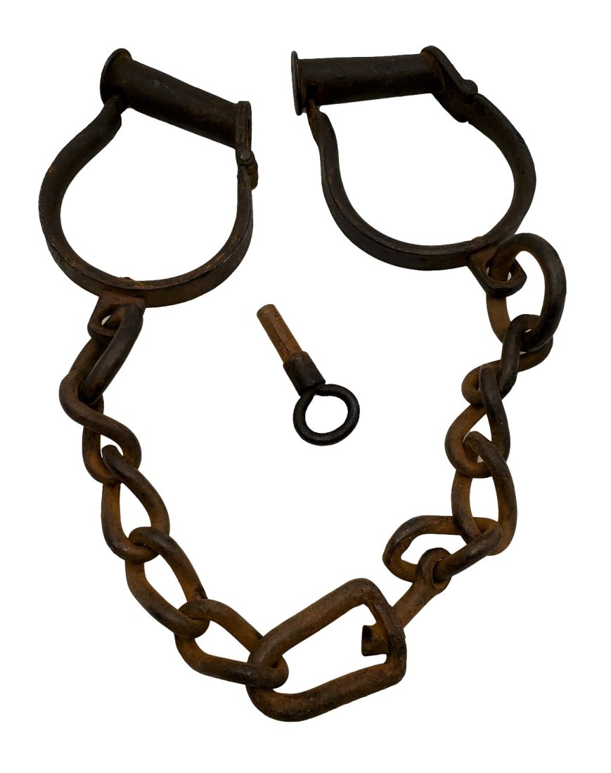 Early Iron Ankle Shackles: Iron ankle shackles with key. Estimated to be from the early 1800s. They are not functioning. The chain length measures 16 inches.We review every item to determine its basic condition. If you require 