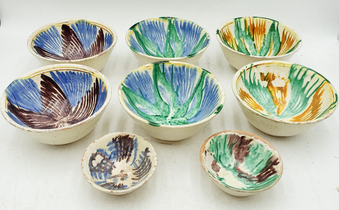 Eight (8) Vintage Painted Terra-Cotta Bowls: Six (6) bowls measure 6 2/4 inches top diameter and stand 3 inches tall. There is paint chipping but no cracks or missing sections of the terra-cotta. There are two painted terra-cotta spi