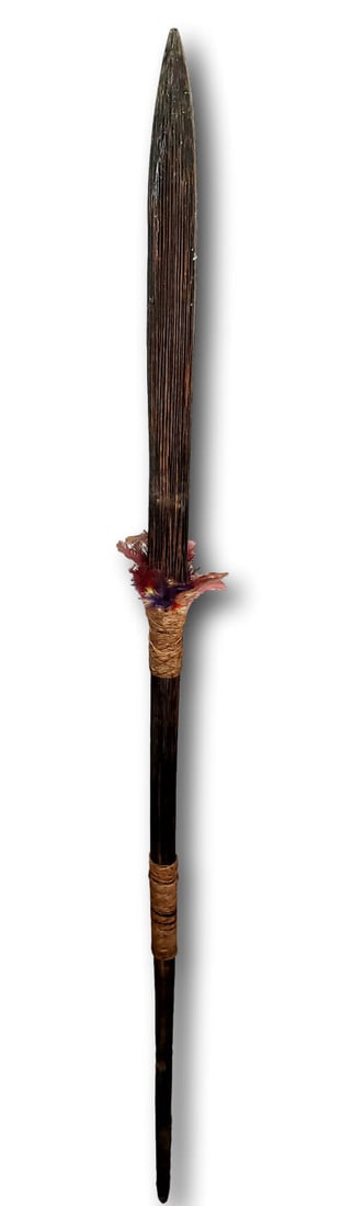 Ecuador South America Head Hunter's Spear - Traphagen: The wood spear has a rope wound grip and a rope wrap that holds colored feather embellishments. The spear is 66 inches long. There are no breaks or repairs. â€“ Provenance: The Traphagen Co