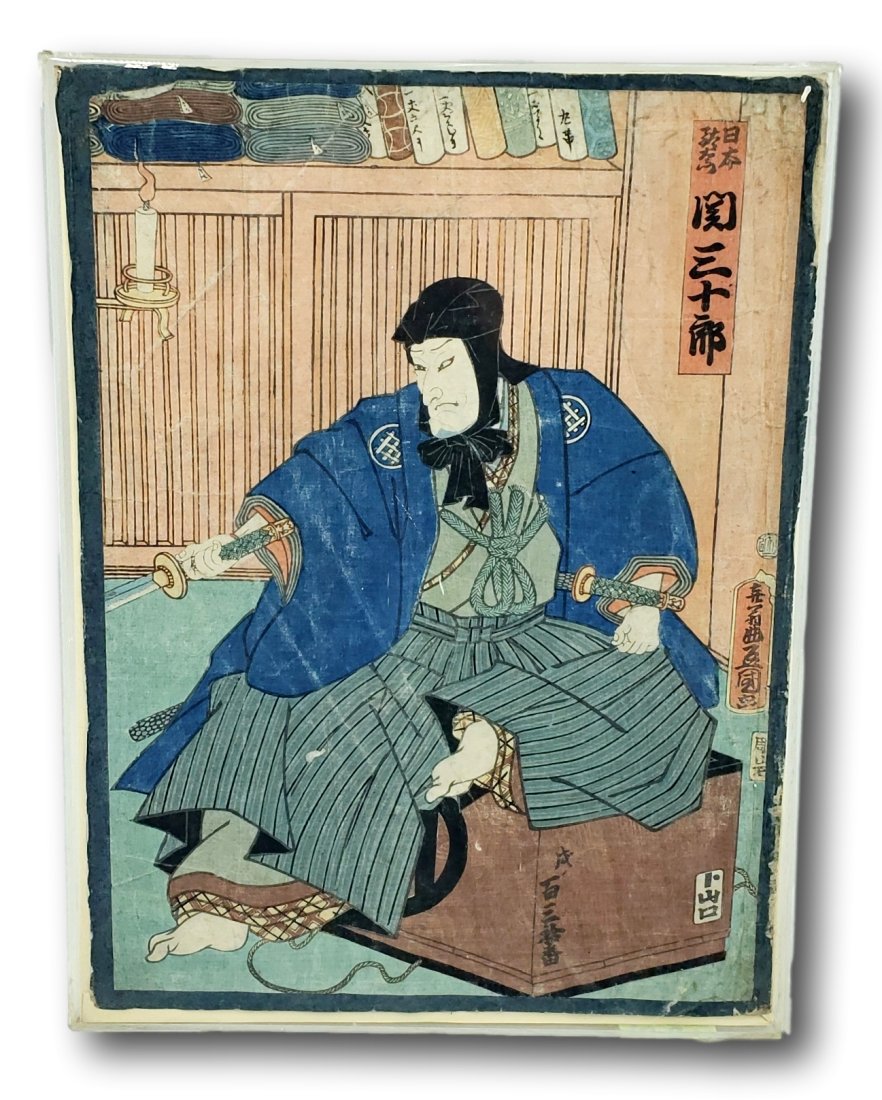 19th Century Japanese Ukiyo-e Woodblock Print: Presenting a striking example of Ukiyo-e, a genre of Japanese woodblock prints and paintings, this piece showcases the rich cultural artistry of 19th century Japan. The print measures 13 1/2 inches by