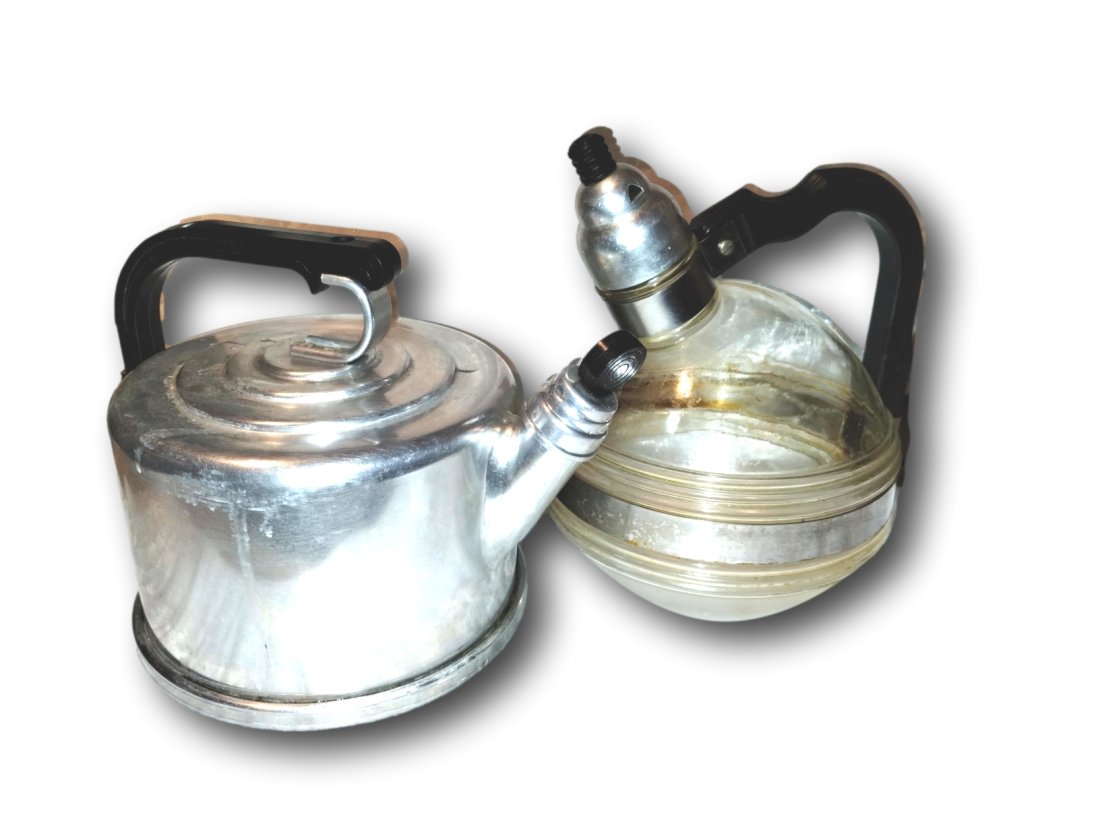 Vintage Deco 1940s Tea Kettles (2): (1) Wear-Ever Aluminum TAC LLC No 1502. The handle and knob on the kettle are Bakelite. Marked as being circa 1940. The whistle still works! Will require light cleaning, for noted mineral deposits fro