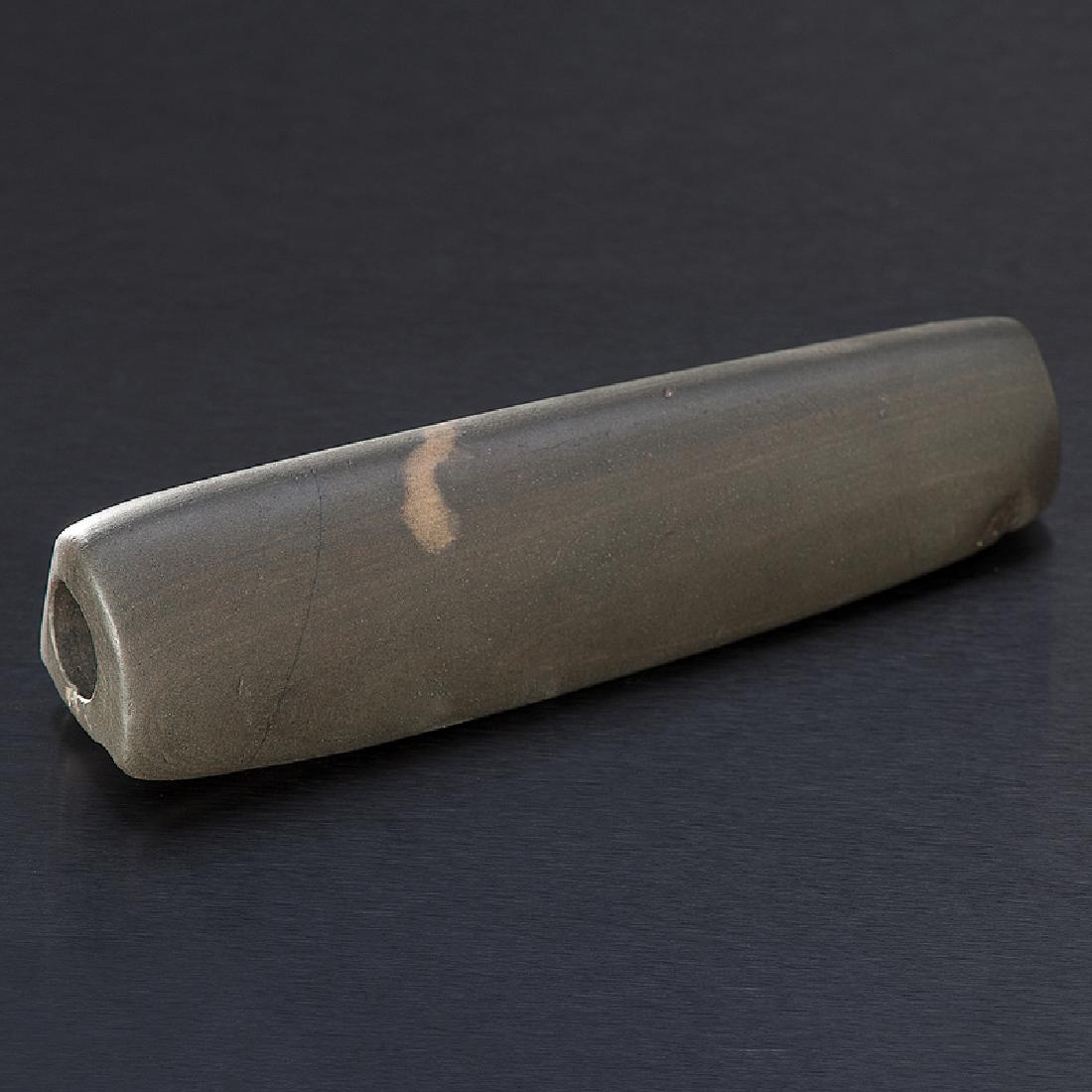 A Concave Humped Bannerstone, From the Collection of