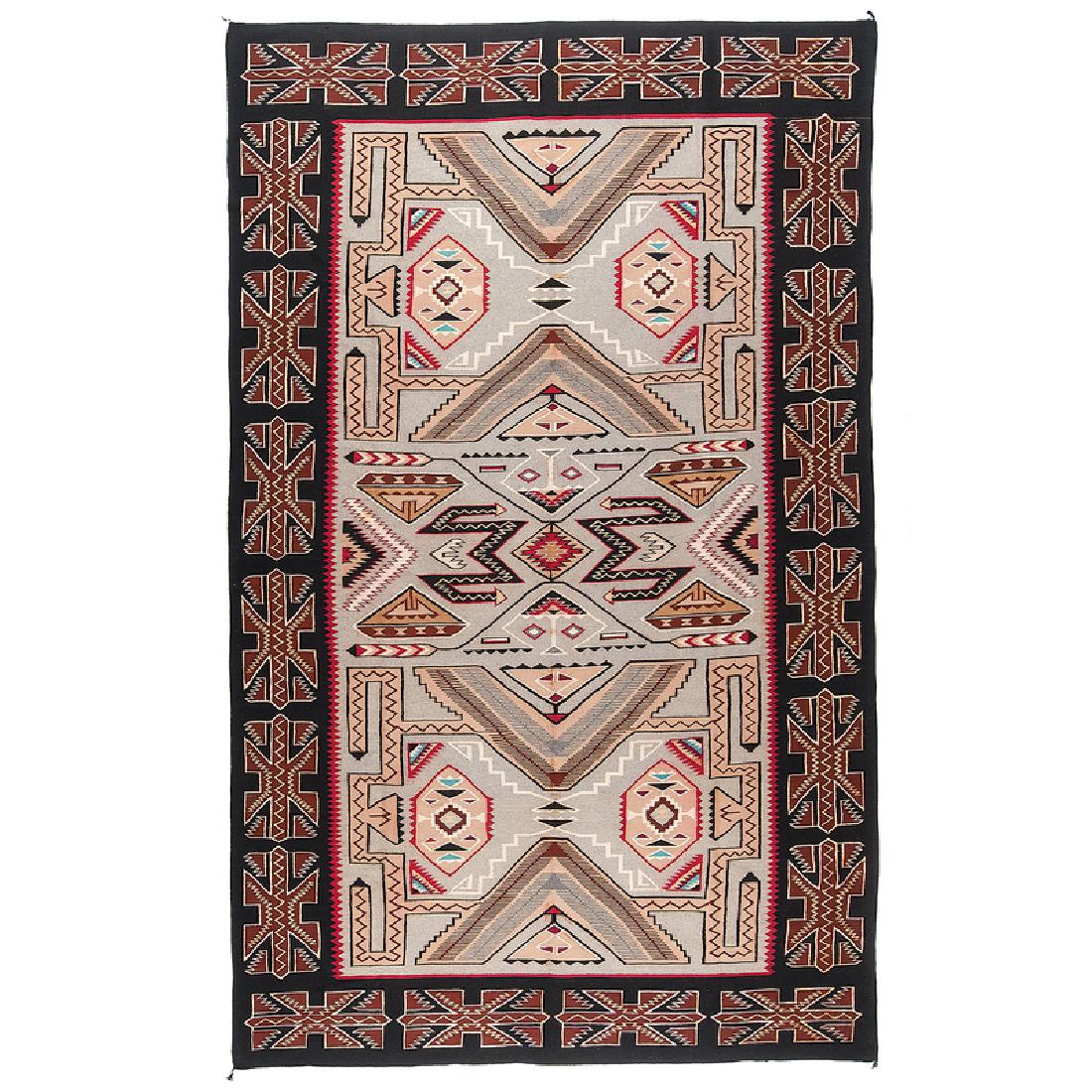 Alice Nelson (Dine, 20th century) Award Winning Teec: room-size rug woven with a complicated design of a variety of meandering geometrics and wide border; with a 1975 Second Place ribbon from Inter-Tribal Indian Ceremonial, 142.5 x 89 in. (11 ft. 8 in.