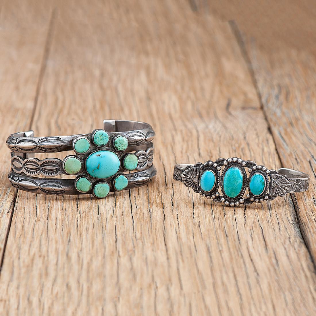 Navajo Silver and Turquoise Cuff Bracelets: lot of 2, includes silver three wire cuff bracelet with heavy stamping and a medium sized centrally set turquoise stone surrounded by eight smaller turquoise stones, interior circumference 6.5 in., ga