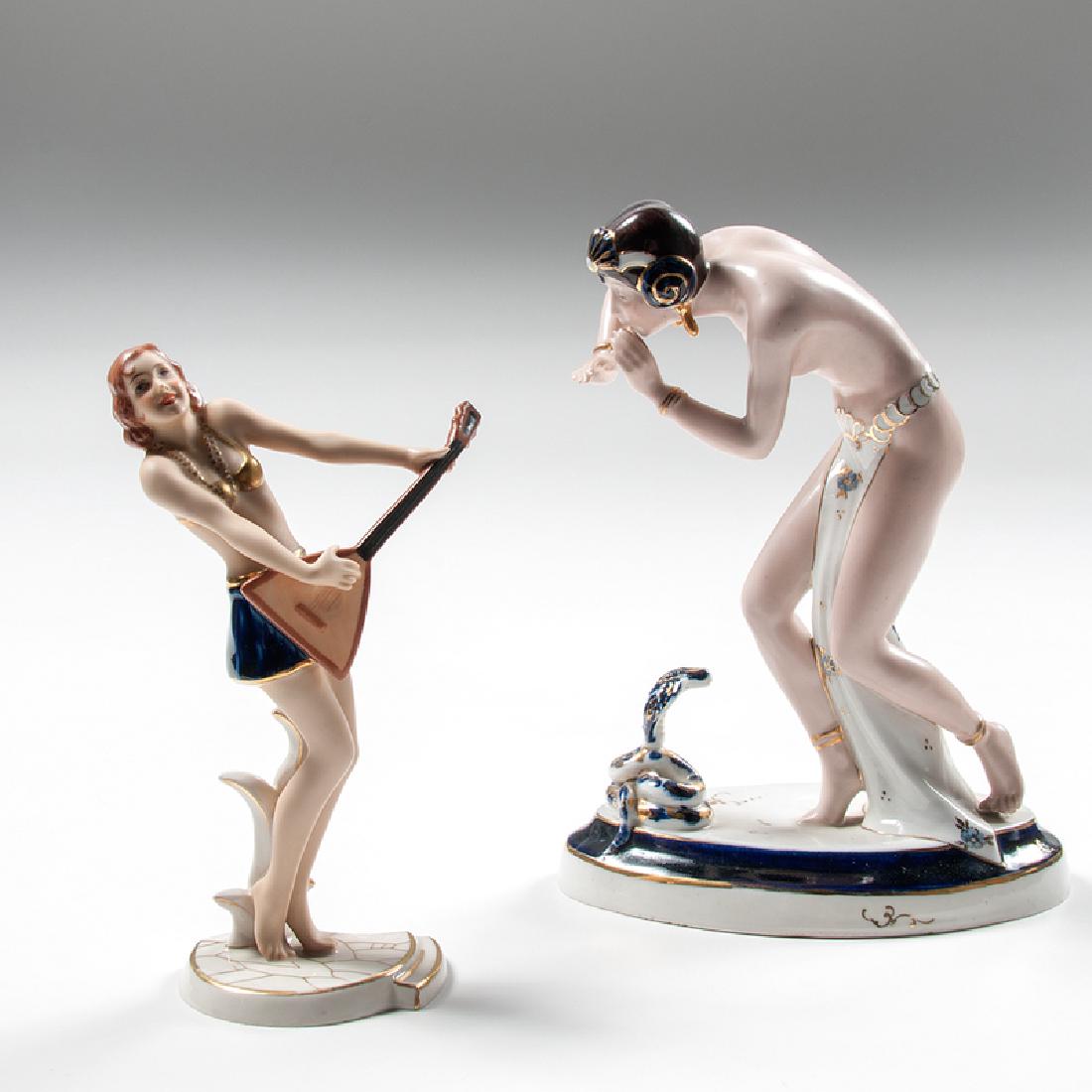 Royal Dux Art Deco Figures, Lot of Two: Czechoslovakia, ca. 1920s-1930s. A group of two porcelain figures by Royal Dux, each with manufacturer's mark on underside, including one of a snake charmer, impressed 702 / 15 P on underside (ht. 9, 