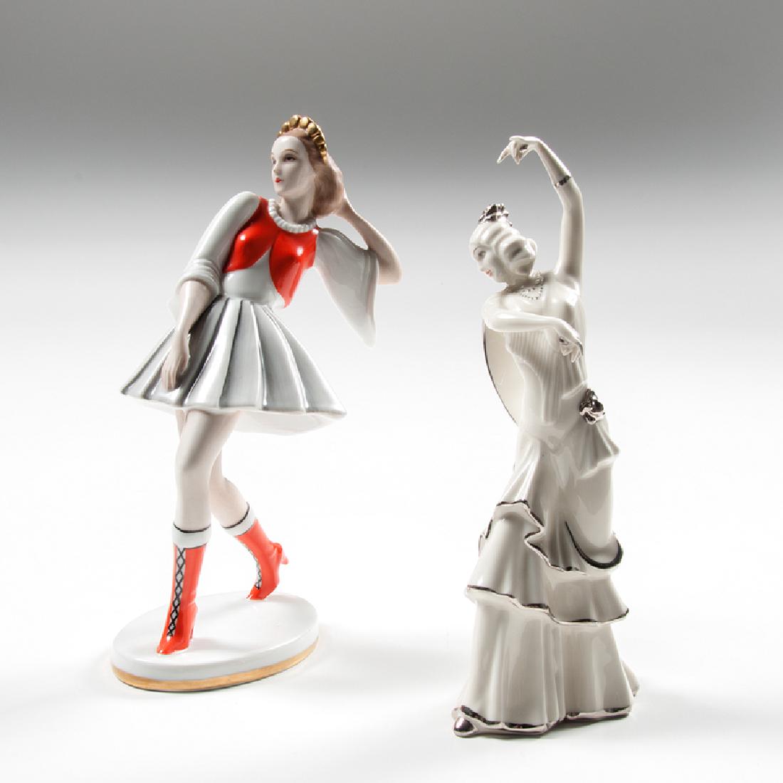 Haas & Czjzek Art Deco Dancers, Lot of Two: Czechoslovakia, ca. 1920s-1930s. A group of two porcelain figures by Haas & Czjzek, each with manufacturer's mark on underside, including one of a woman wearing a red-orange vest and boots and a gold