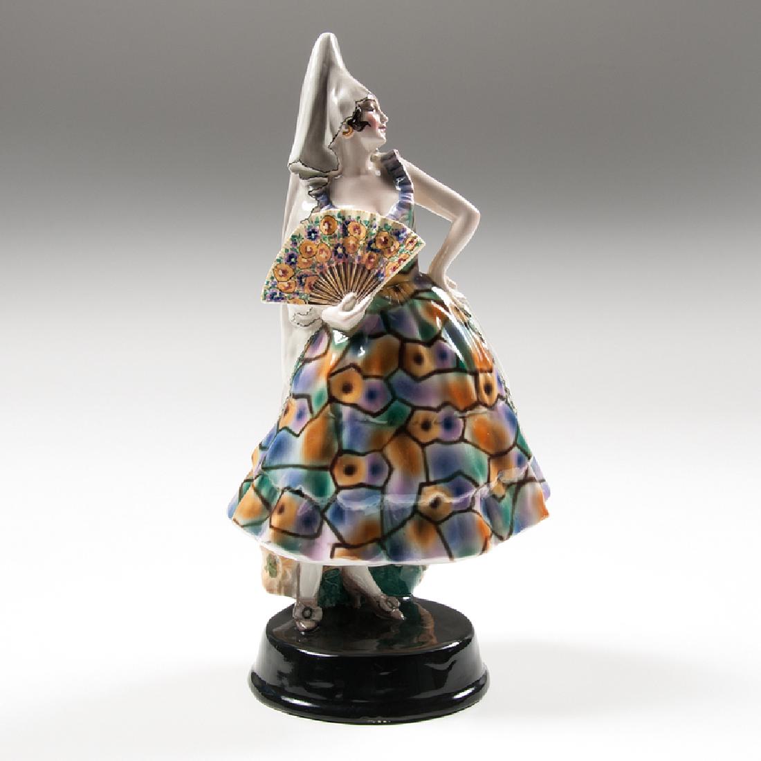 Josef Lorenzl (Austrian, 1892-1950) for Goldscheider: Austria, 1920s. A porcelain figure by Josef Lorenzl for Goldscheider of a Spanish dancer, with a woman in a colorful dress holding a fan, with manufacturer's mark and impressed 440 / 82 / 10 on und