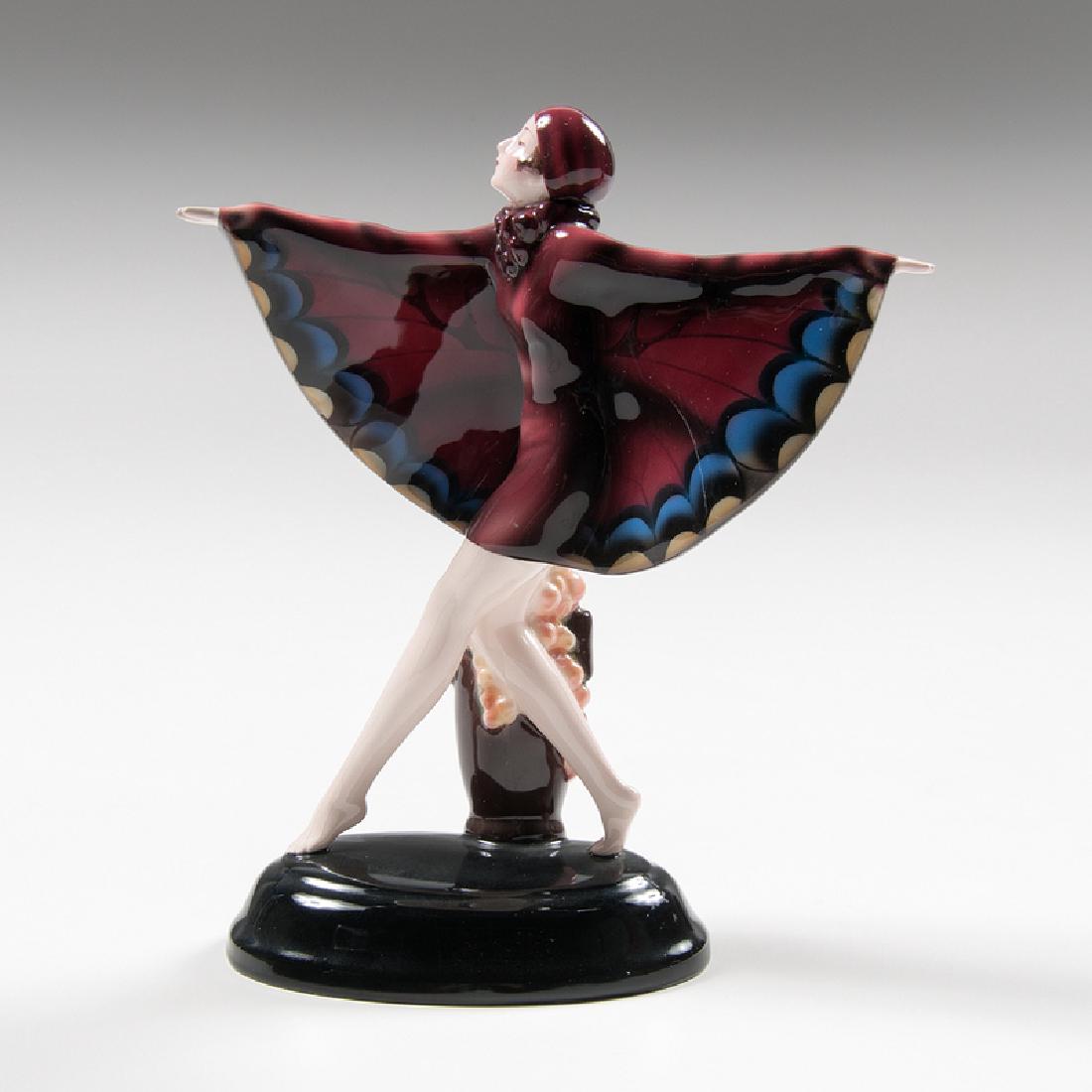 Josef Lorenzl (Austrian, 1892-1950) for Goldscheider: Austria, ca. 1929. A porcelain figure by Josef Lorenzl for Goldscheider titled "Captured Bird" depicting a woman in a butterfly costume having her arms stretched out and a flowerpot at her feet, with