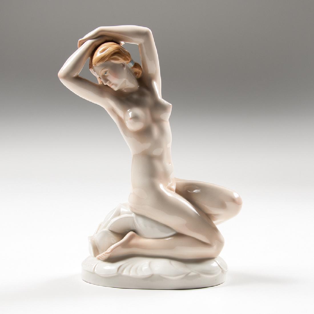 August Wilhelm Goebel (German, 1883-?) for Karl Ens: Germany, ca. 1930s. A porcelain figure by August Wilhelm Goebel for Karl Ens of a bathing nude resting on a large lily pad or flower, with manufacturer's mark and impressed 58911 / 15 on underside, 