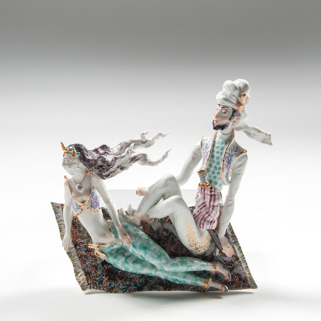 Meissen "Flying Carpet" Wall Sculpture: Germany, ca. 1920s-1930s. A porcelain hanging wall sculpture by Meissen titled "Flying Carpet" depicting two figures in Middle Eastern dress rising a carpet, with manufacturer's mark and impressed 73