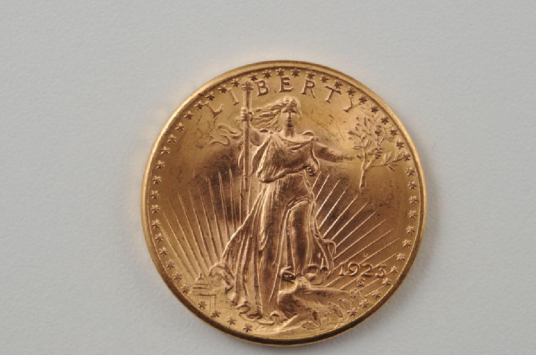 United States 1923 D Saint Gaudens Double Eagle in Gold: A 1923 D Gold Saint Gaudens double eagle twenty dollar gold coin. 21.47 dwt.