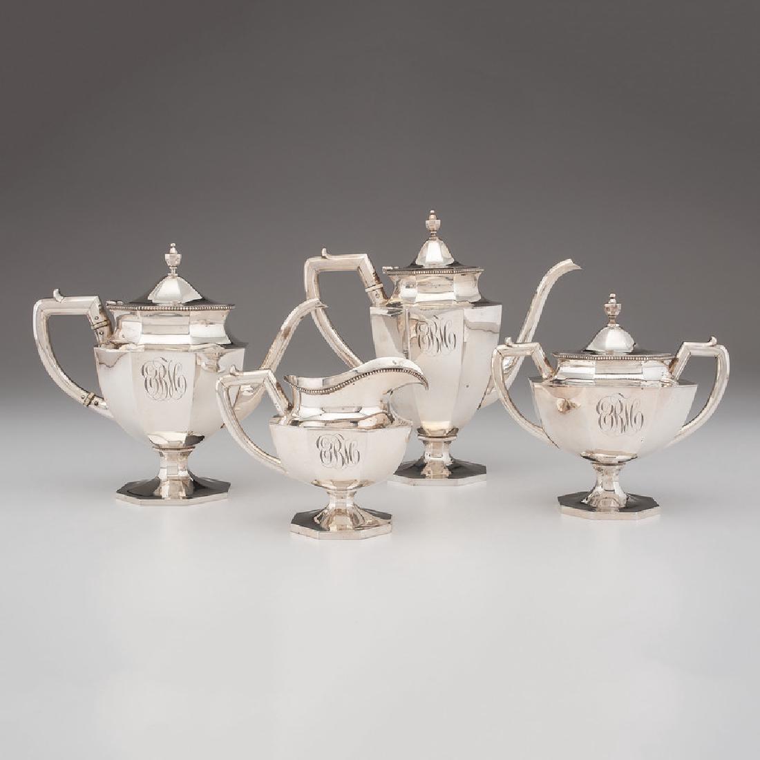 Fine Duhme & Co. Sterling Tea and Coffee Service: American (Cincinnati), 19th century. A four-piece sterling silver tea and coffee service by Duhme & Co., including a teapot, coffee pot, creamer and sugar, each paneled with urn-form finials on octago