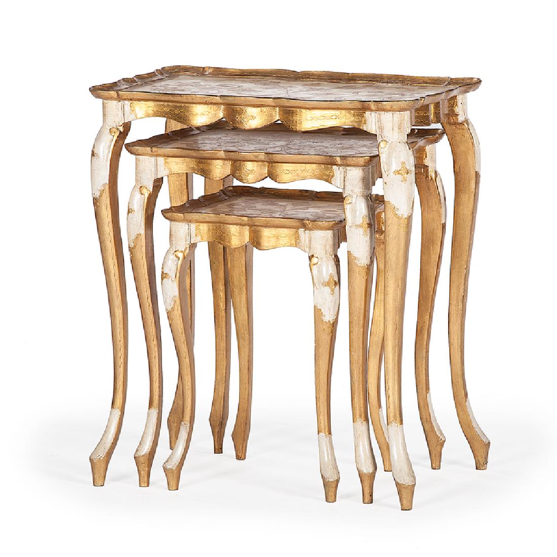 Giltwood Nesting Tables: Italian, 20th century. Three giltwood nesting tables, each having a floral decorated surface with scalloped edges and outset corners, rising on cabriole legs; largest ht. 25, wd. 21, dp. 13 in. Proven