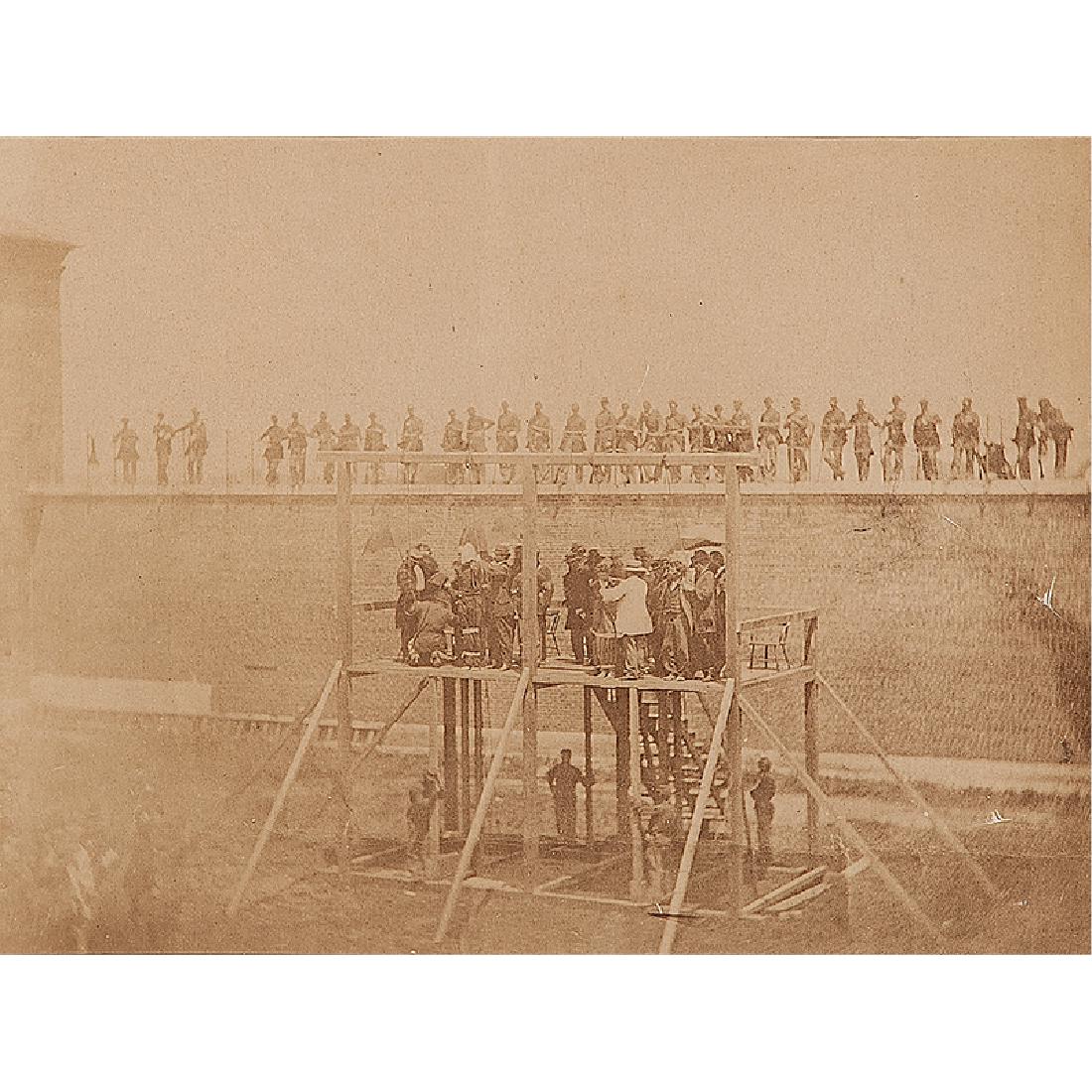 Alexander Gardner, Albumen Photograph of the Hanging of: Albumen photograph, 6.5 x 8.75 in. on mount trimmed to 7.5 x 10.25 in., capturing the hanging of the Lincoln conspirators from the gallows in the yard of Fort McNair, Washington, DC. Taken on July 7