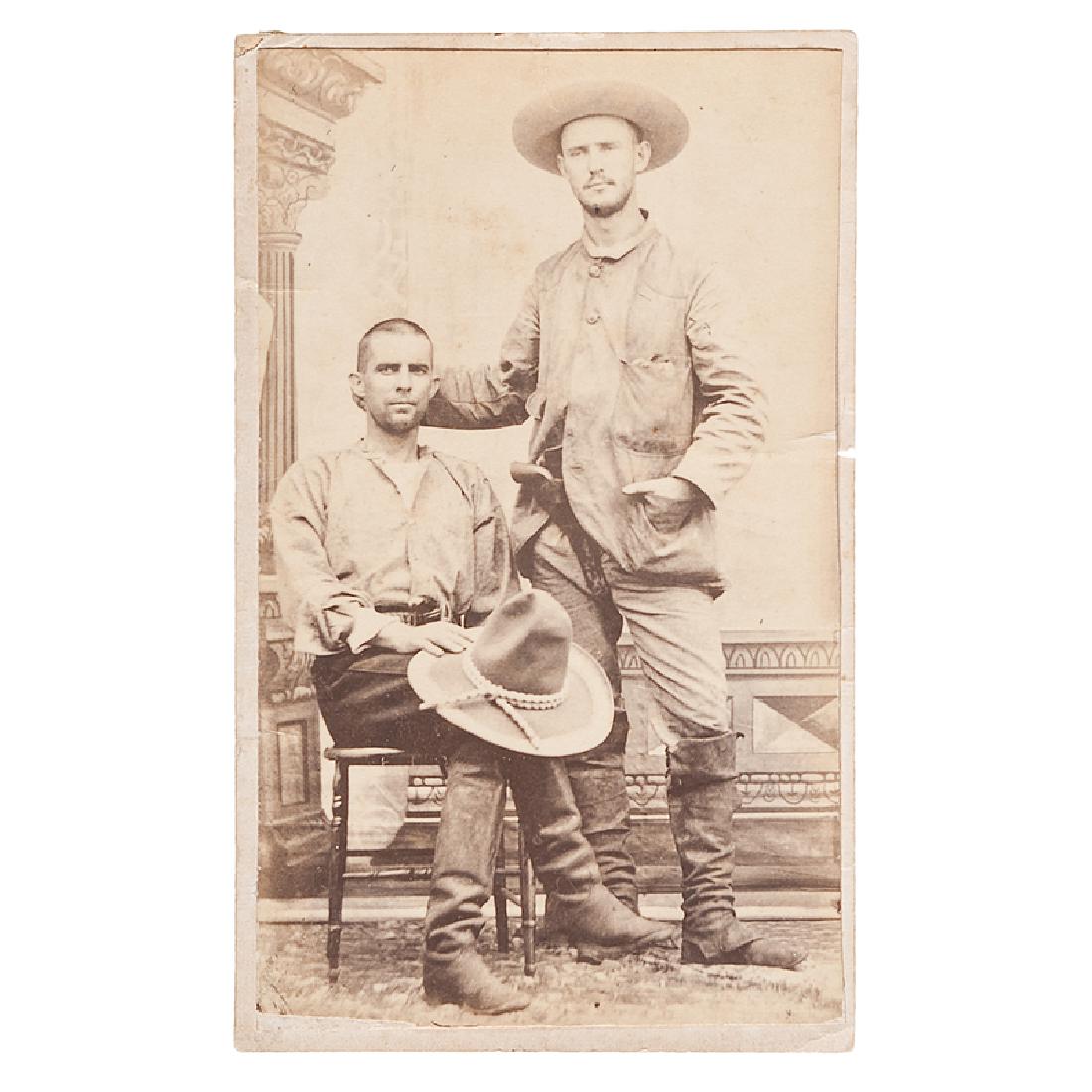 Mexican CDV of Armed Cowboys: Albumen CDV with the verso stamp of "Juan J. Silveira, Fotografio / Minatitlan," and the inked identification "W.S. Harris and Friend." Both men wear riding boots and have pistols tucked into th