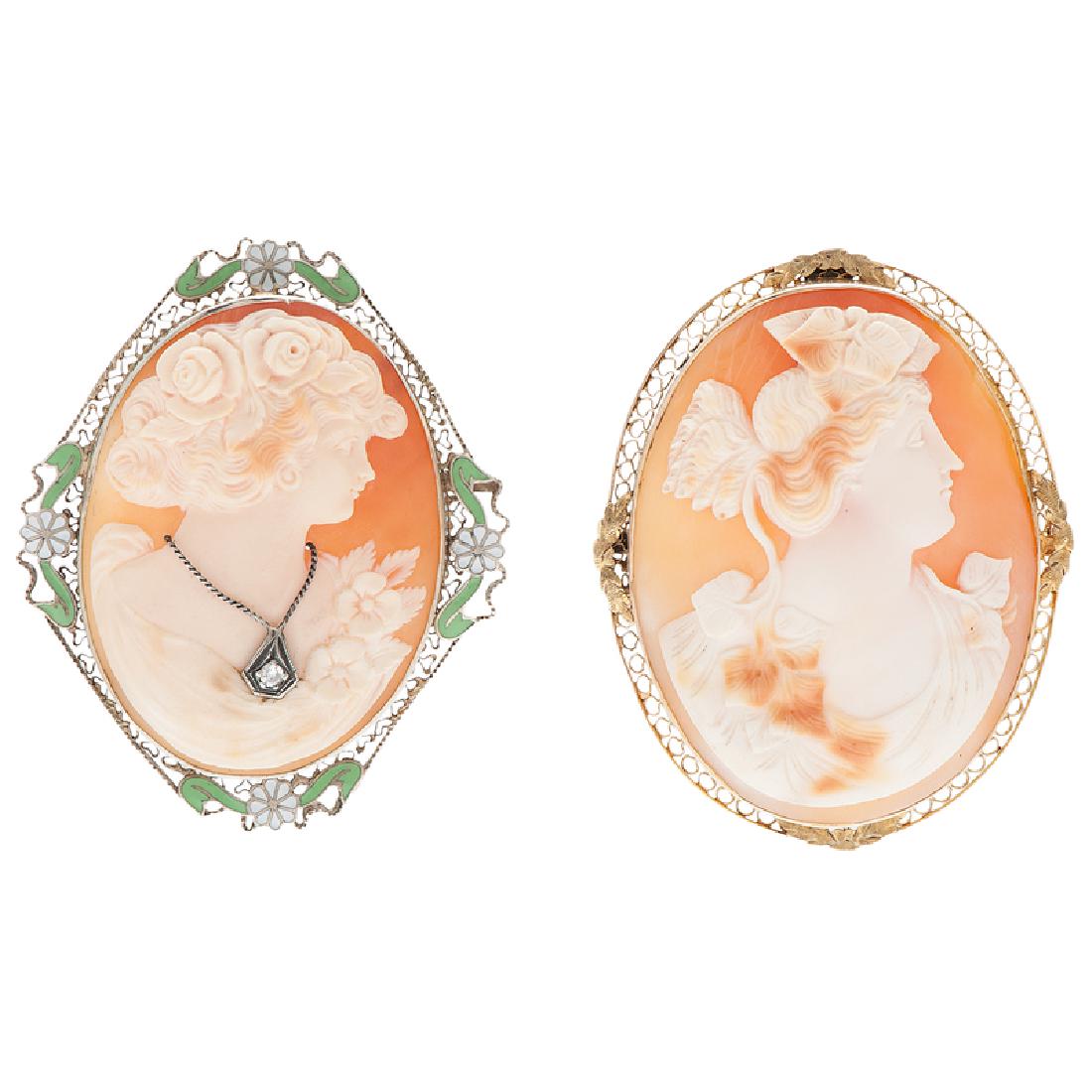 Habillé Cameo Convertible Brooch/Pendant in 14 Karat: A bezel set shell cameo wearing a necklace set with a single cut diamond, the cameo measures approximately 43mm x 32mm. The mounting is embellished with green and white enamel flowers, safety clasp a