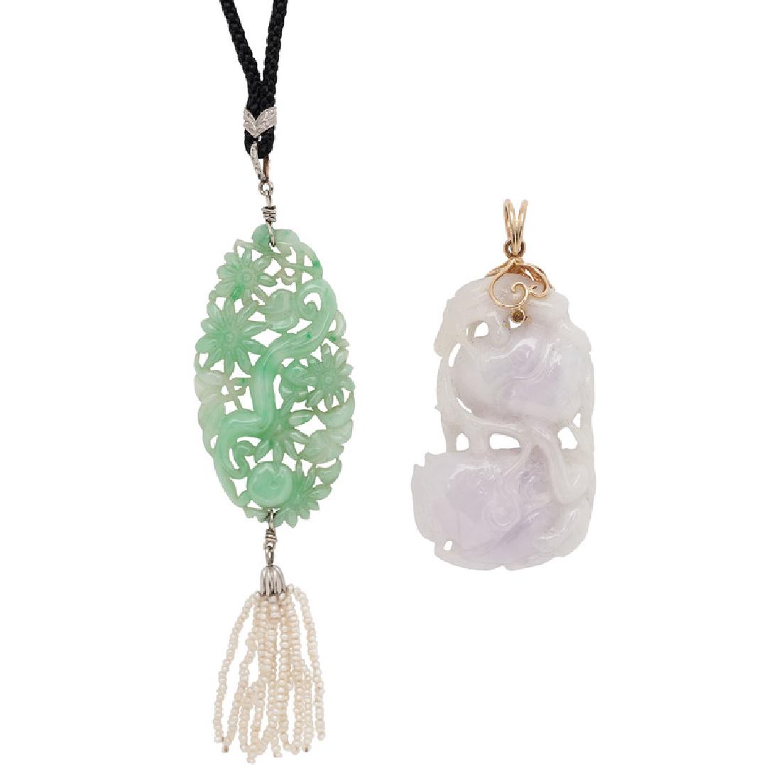 Carved Jade Pendants with Karat Gold Findings: A carved and pierced green jade pendant with a pearl tassel measuring 1.75" x .875" (jade only) suspended on a 29" cord with 18k white gold findings along with a white and purple carved and pierced j