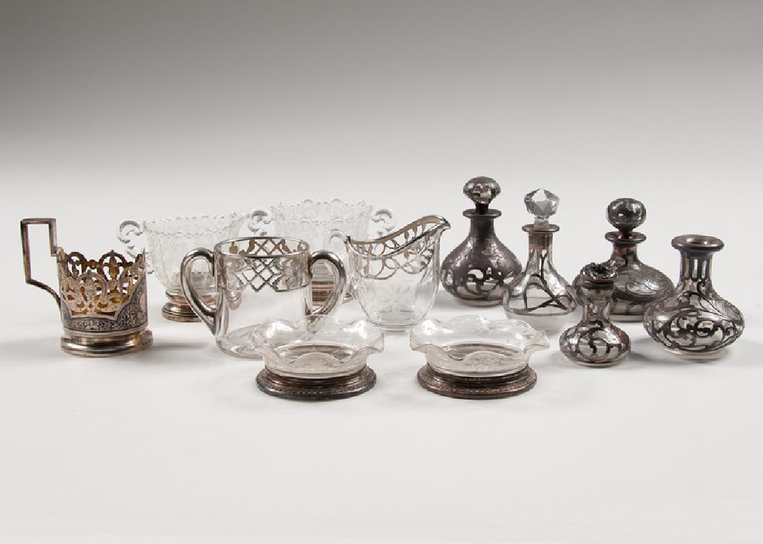 Sterling and Glass Tablewares: American, 20th century. A group of twelve sterling and glass tablewares, each marked STERLING, including:Â two sugar and creamer sets, including one set by Cambridge in the "Chantilly" pattern, and