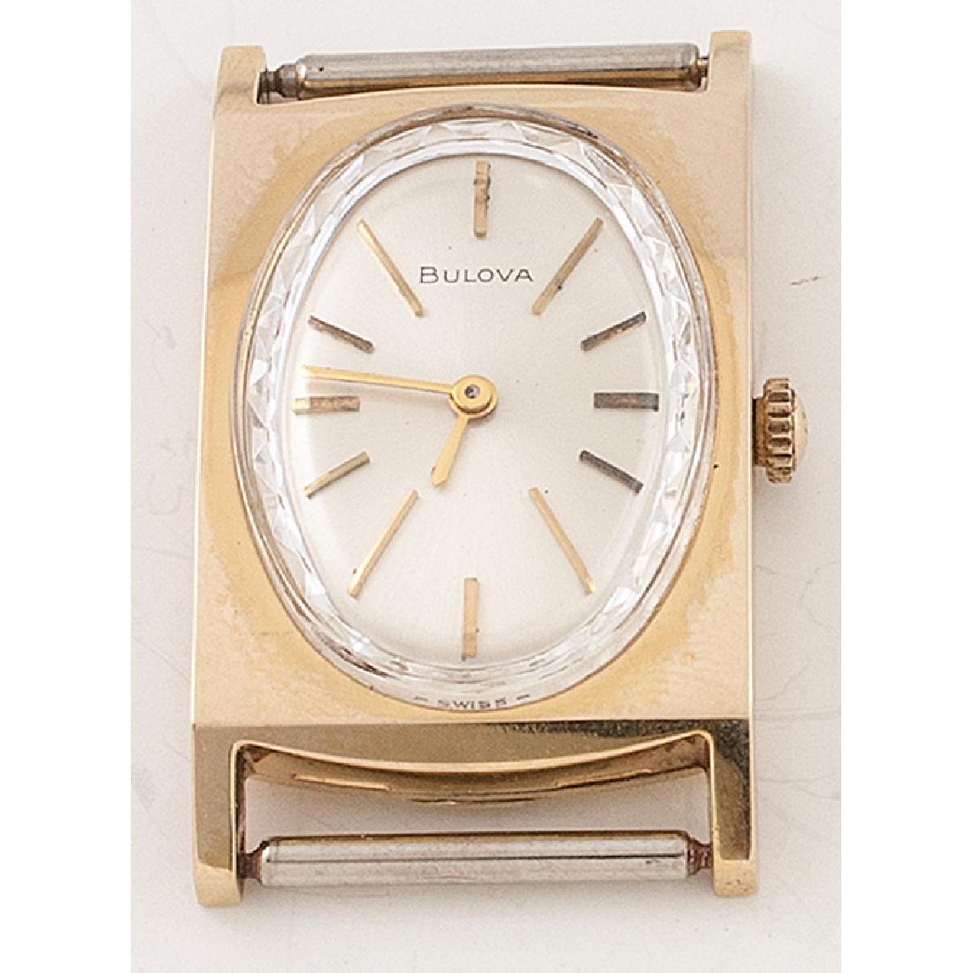 Bulova Gold Tone Wrist Watch Ca. 1970: Bulova ca 1970. Gold tone 21mm x 37mm case. Bulova 6CF seventeen jewel mechanical movement. Faceted oval crystal. White satin dial with applied gold markers and gold hands. Bulova crown.