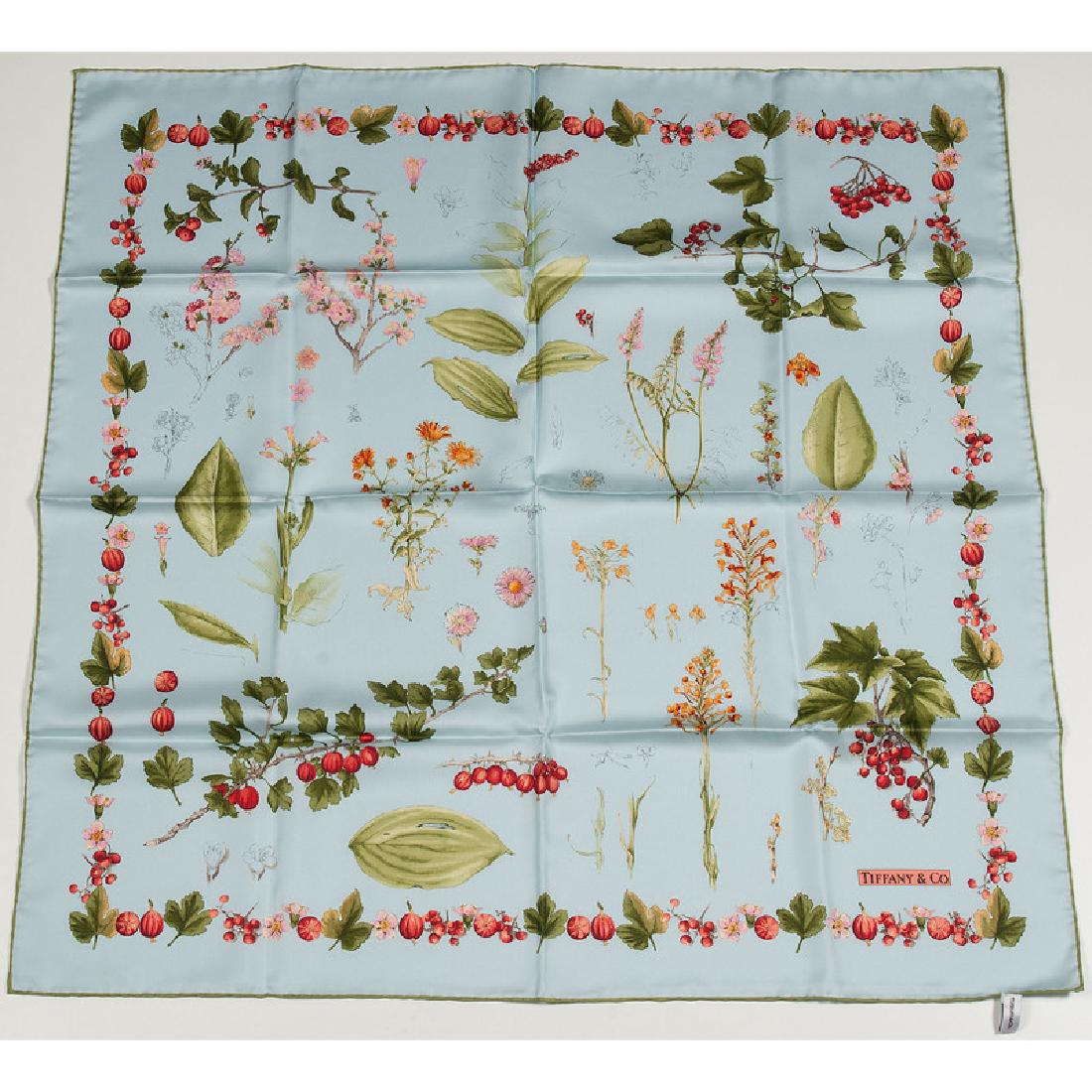 Tiffany & Co. Silk Scarves: Three Tiffany & Co. silk scarves in black, pink, and blue. Each features rolled edges. Measures 35" x 35". Provenance: Property from the Collection of Dr. M. Donald Hayes. To Be Sold Without Reserve.