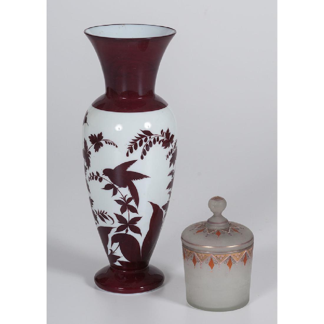 Victorian Ruby and White Vase, Plus: English and Continental. A ruby and white glass vase, PLUS a glass lidded jar with enamel and painted decorations; vase ht. 11.75 in. Provenance: Property from the Collection of Dr. M. Donald Hayes. T