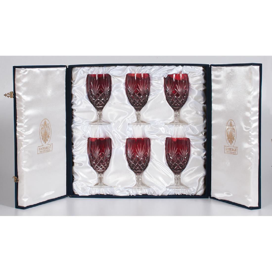Faberge Ruby Crystal Goblets: 21st century. A set of twelve ruby cut to clear crystal ice tea goblets, all with etched marks and in original cases; ht. 7 in. (each). Provenance: Property from the Collection of Dr. M. Donald Hayes.