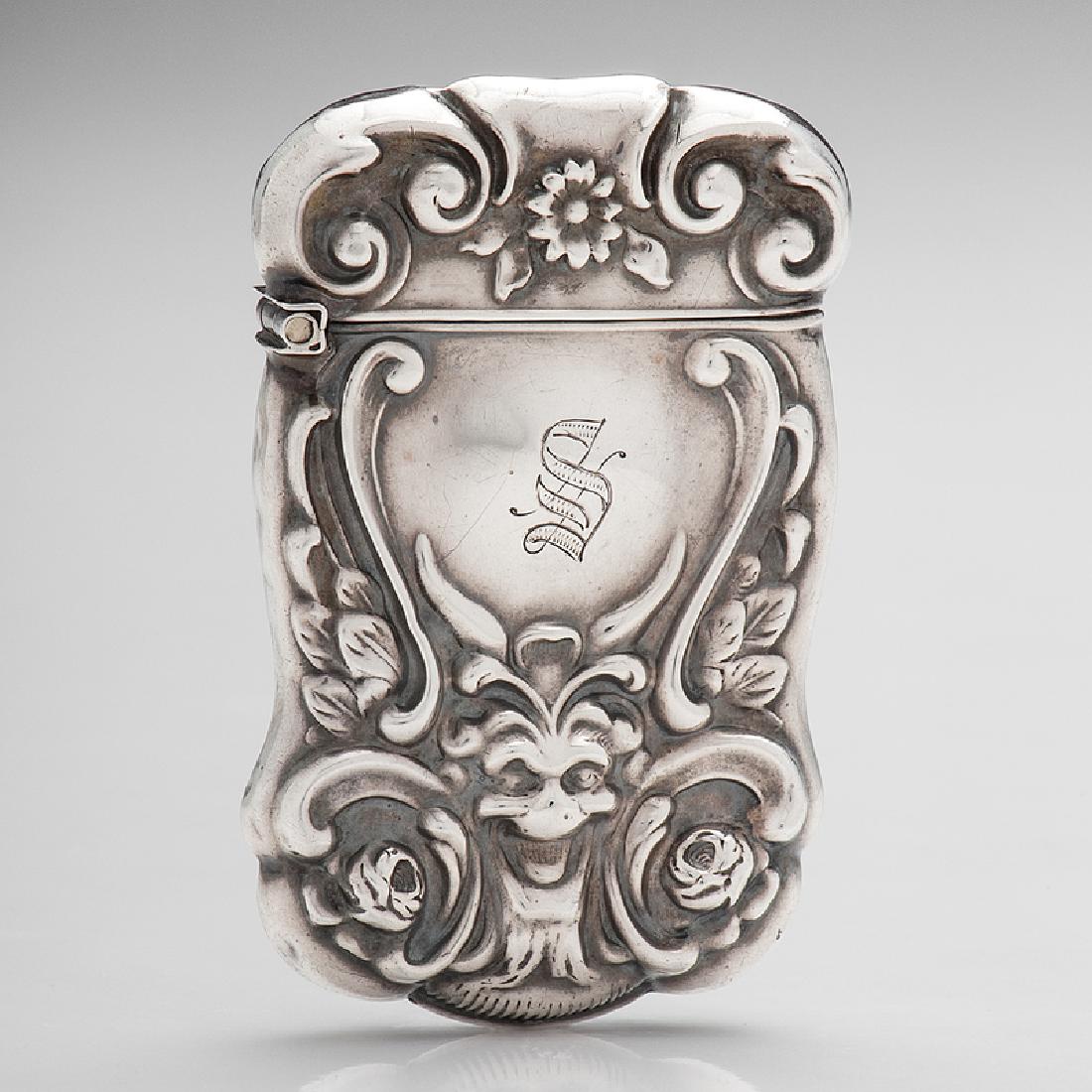 Sterling Match Safe Featuring A Grinning Devil: American, late 19th century. A sterling silver match safe featuring a repoussÃ© horned figure or devil on either side with scroll and floral embellishments. One side is monogrammedÂ S, markedÂ S