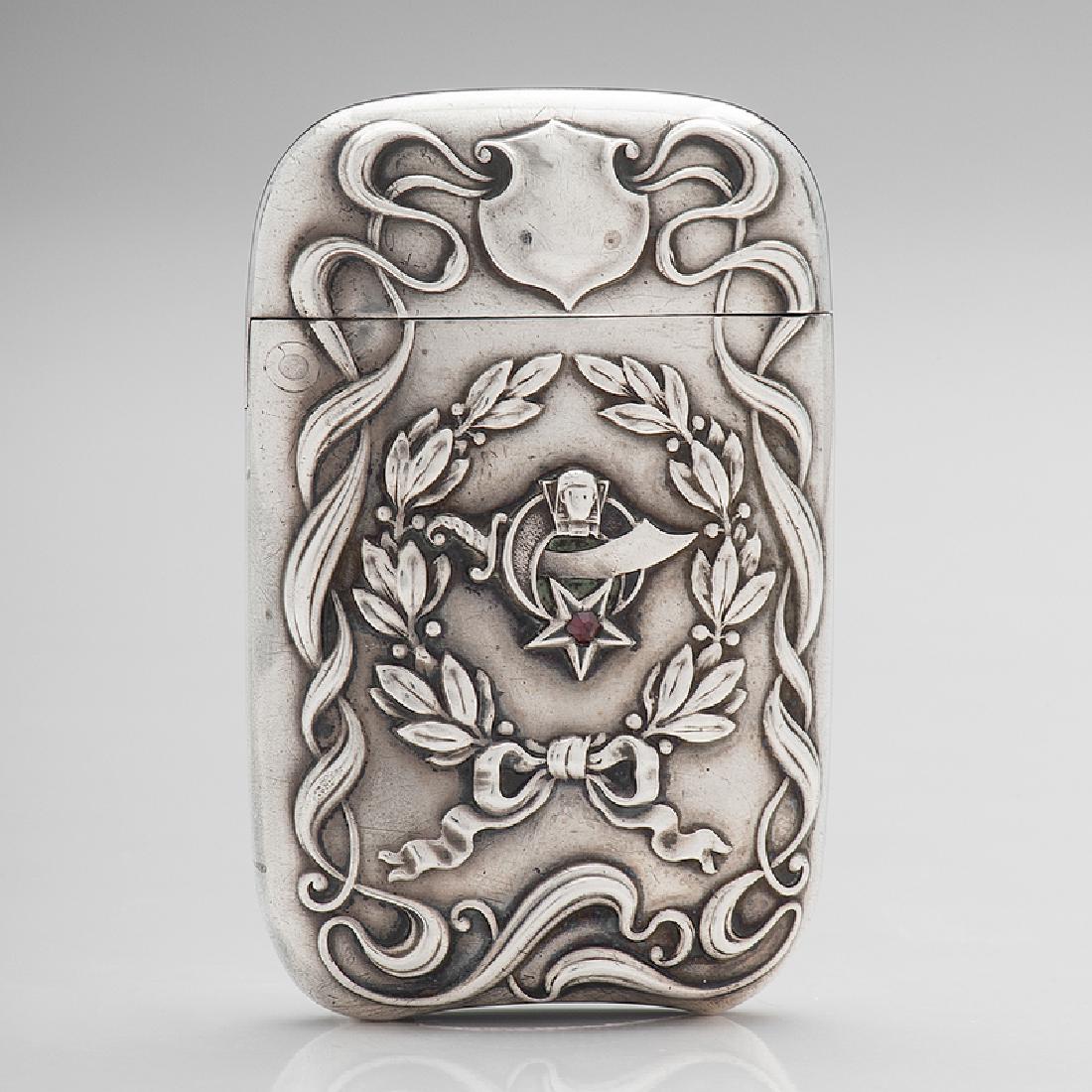 American Sterling Match Safe Decorated with the: American, late 19th-early 20th century. A sterling silver match safe decorated with the emblem of ShrinersÂ Fraternity, embellished with a ruby star, marked Sterling; ht. 2 1/2, wd. 1 5/8 in.