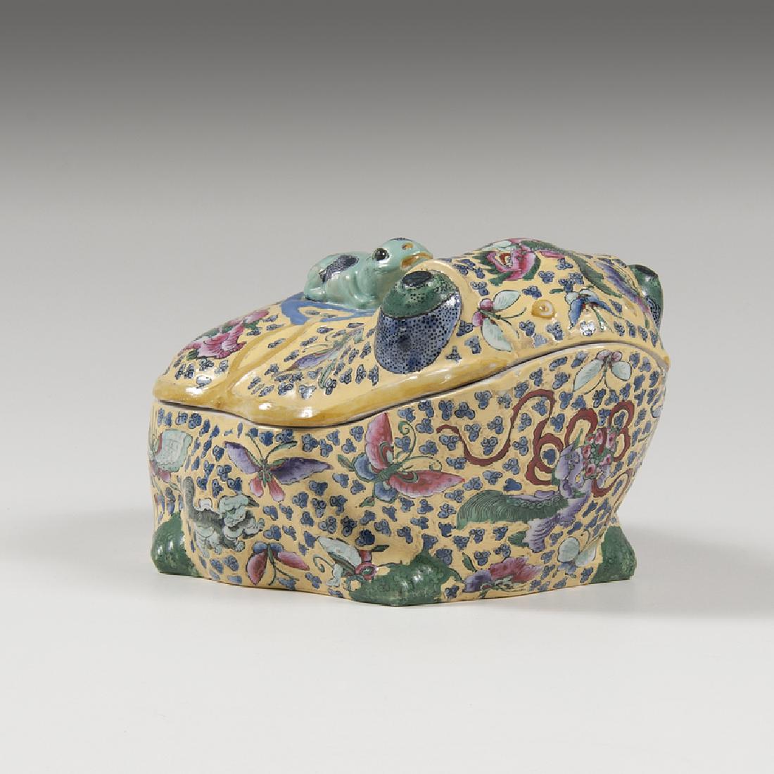 Famille Jaune Frog Tureen: Chinese, late 19th century. A porcelain export tureen in famille jaune pattern, with frog finial and decorated with foo dogs and butterflies, unmarked; ht. 7, wd. 10.5, dp. 9 in. Provenance: Propert