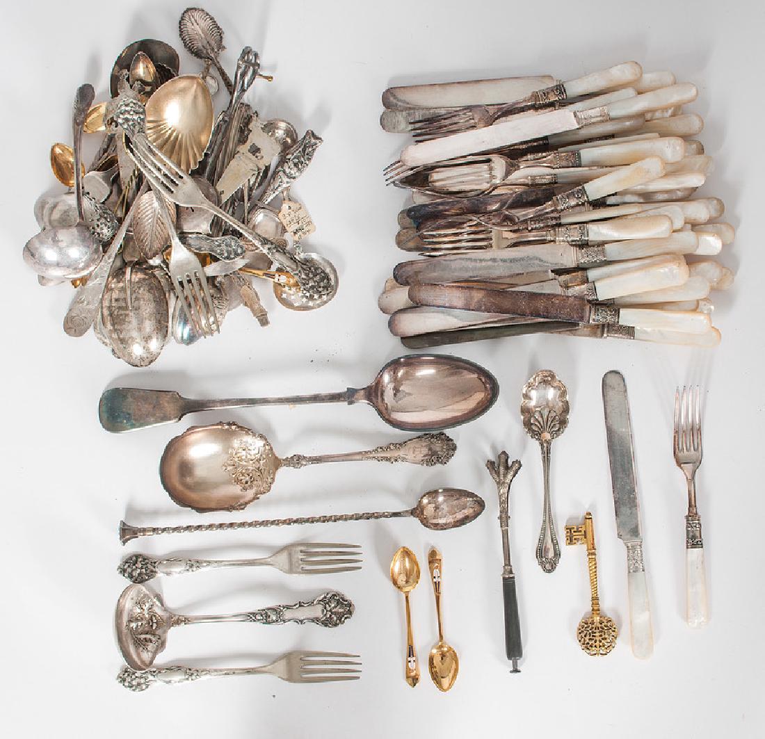 Mother of Pearl Handled Flatware and Other Silverplate: 19th-20th century. A large set of mother-of-pearl handled knives and forks by various makers, and a large group of silverplated utensils, from serving pieces to salt spoons; largest lg. 12 in.