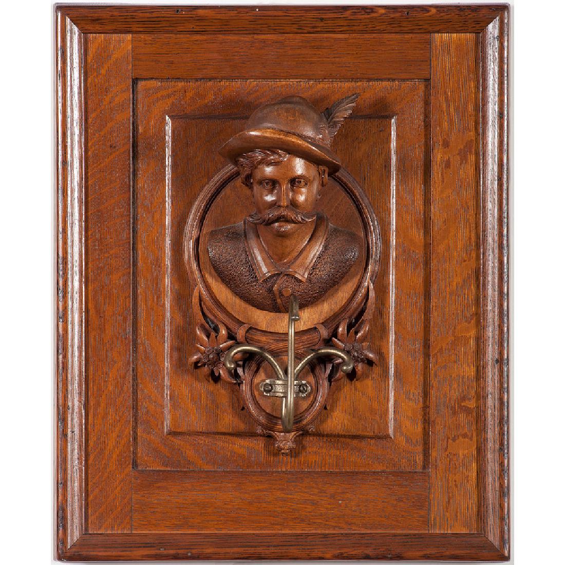 Black Forest Carved Coat Rack: German, 20th century. A Black Forest carved coat rack featuring a finely carved gentleman; 17.5 x 14.5 in.
