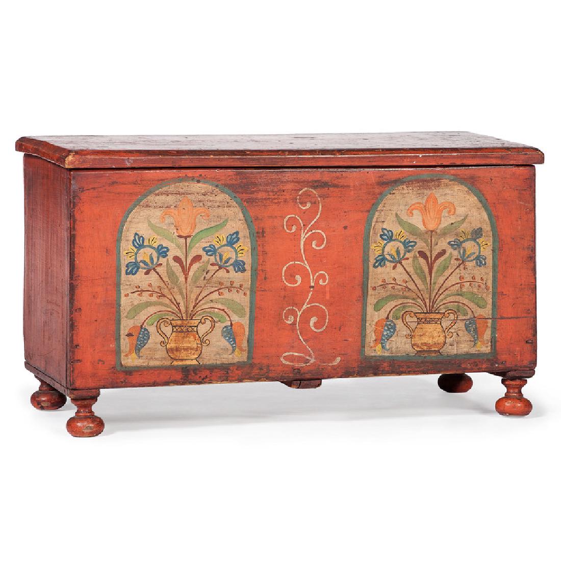 Pennsylvania Miniature Painted Blanket Chest: American (Pennsylvania), 19th century. A six board miniature blanket chest in red paint, having a two panel design with vase and floral decoration, rising on bun feet; ht. 15.5, wd. 27.25, dp. 13 in.�