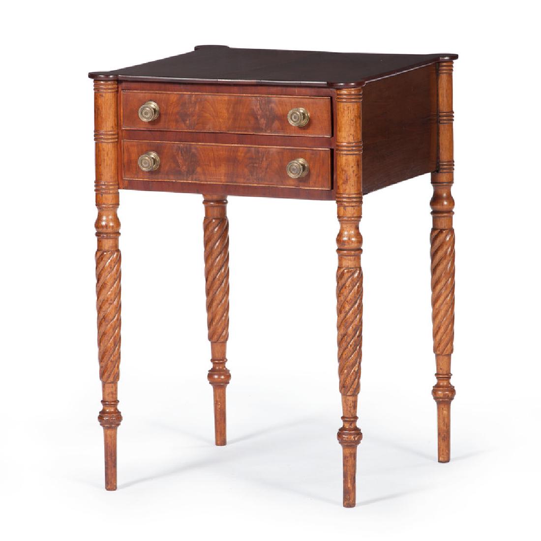 Sheraton Two Drawer Stand: American, 19th century. A Sheraton two drawer stand in walnut, having a square surface with outset corners, above two cockbeaded and dovetailed drawers with brass pulls, all rising on continuous spira