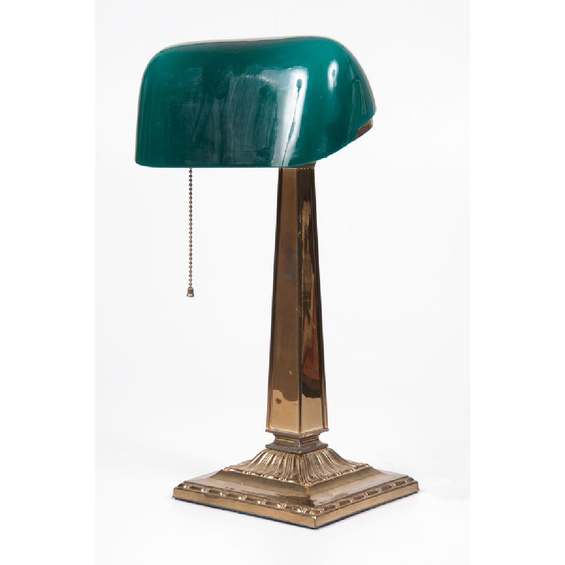 Emeralite Desk Lamp: Early 20th century. A brass Emeralite desk lamp by H.G. McFaddin & Co., with cased glass shade; oah. 17.25 in.