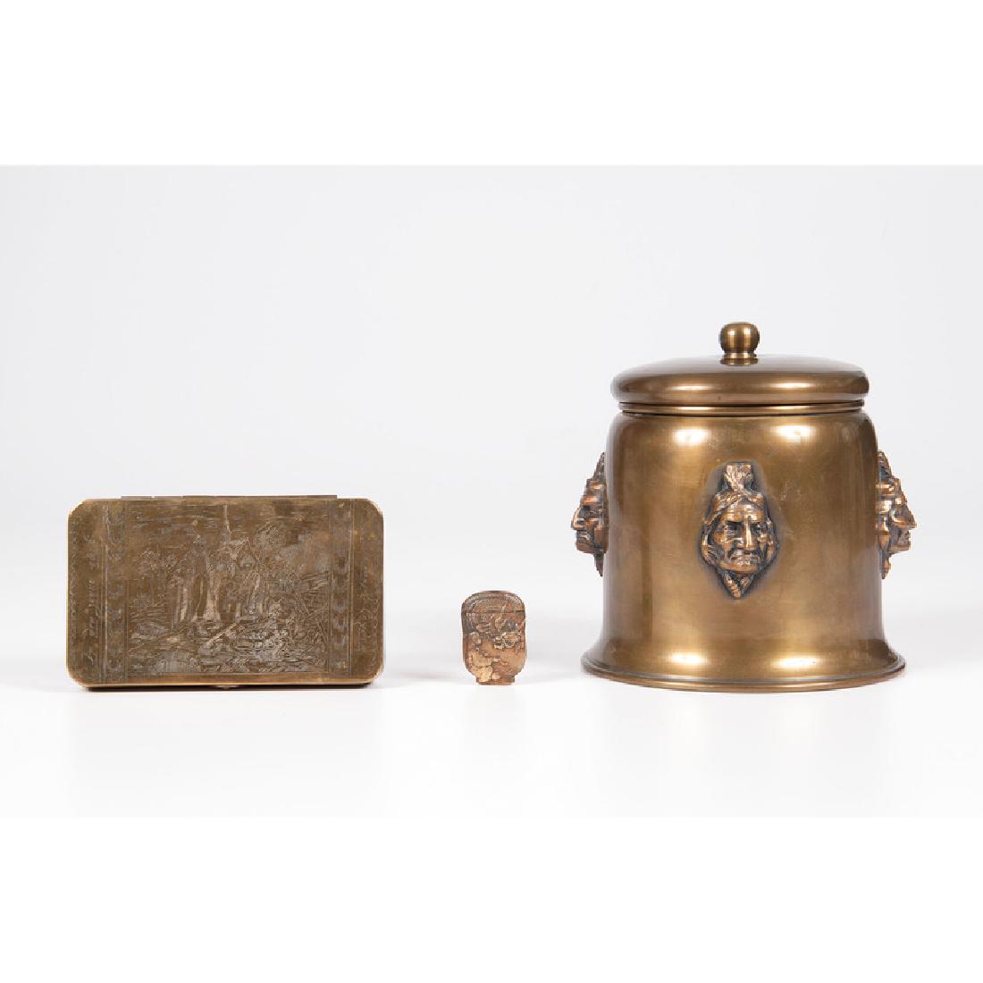 Brass Humidor, Matchsafe, and Tobacco Box: 19th-20th century. An engraved brass tobacco box, a matchsafe with dragon lid and a humidor with applied masks; humidor ht. 7, dia. 6.25 in.