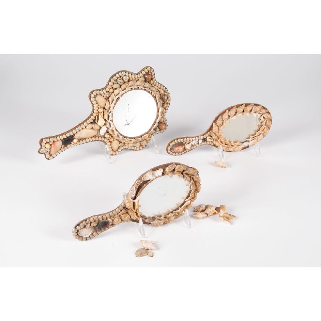 Shell-Decorated Hand Mirrors: Three shell decorated hand-held mirrors; largest ht. 13, wd. 8 in., smallest ht. 10, wd. 5 in.