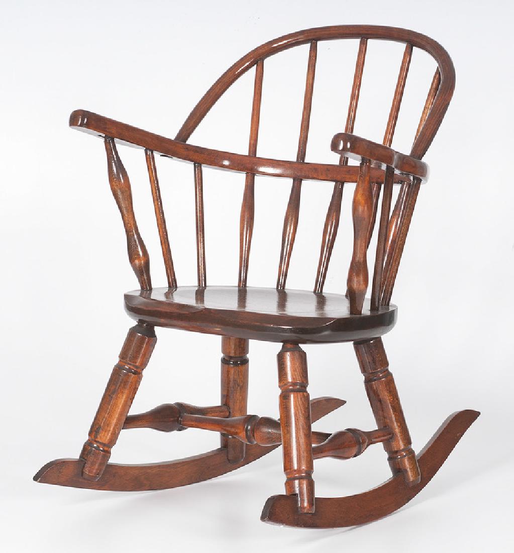 Child's Windsor Rocker: American. A child's continuous arm Windsor rocking chair with spindle back; oah. 22.5 in. Provenance: Property from the Collection of Dr. M. Donald Hayes. To Be Sold Without Reserve.